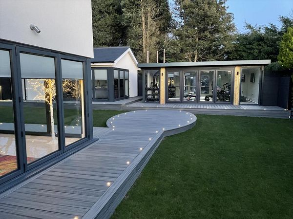 Trex Transcend Island Mist. This 200 square metre deck won us Deck of the Year in 2022, it had everything including curves, inlay, lighting and glass balustrades. The customers in Meopham, Kent were thrilled with the finished project.