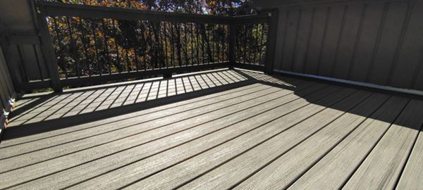 Trex Enhance Naturals decking installation with hidden fasteners in Honey Grove color with heat mitigating technology.