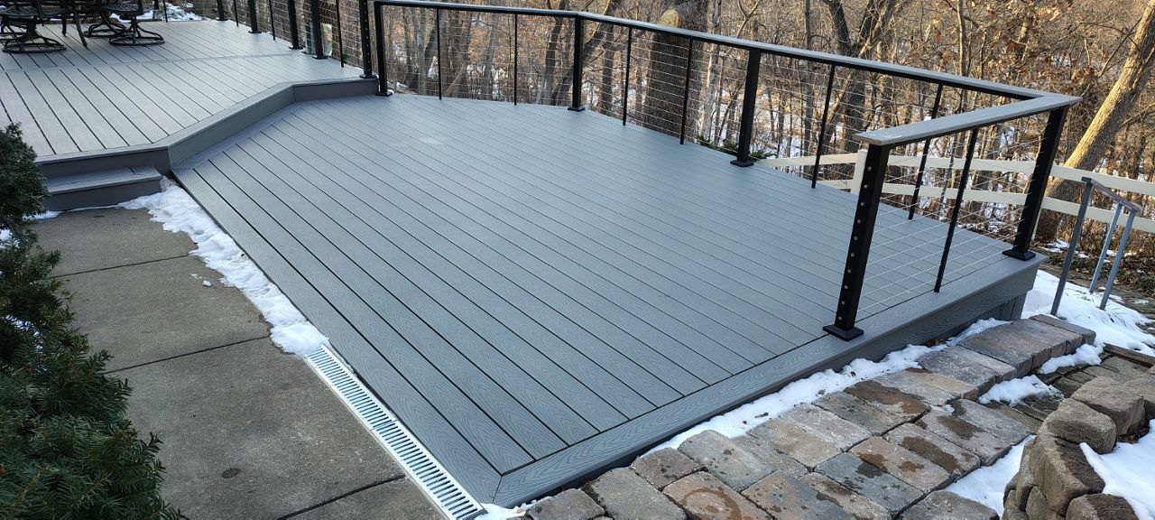 Trex Select Pebble Grey decking installation with black powder coated cable railing.