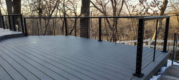 Trex Select Pebble Grey decking installation with black powder coated cable railing.