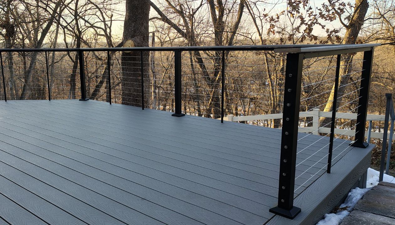 Trex Select Pebble Grey decking installation with black powder coated cable railing.