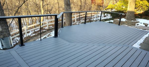 Trex Select Pebble Grey decking installation with black powder coated cable railing.