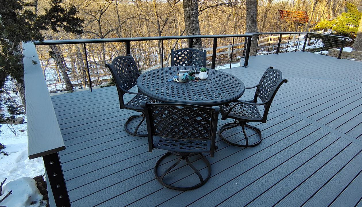Trex Select Pebble Grey decking installation with black powder coated cable railing.