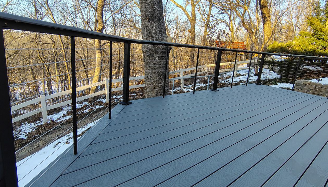 Trex Select Pebble Grey decking installation with black powder coated cable railing.