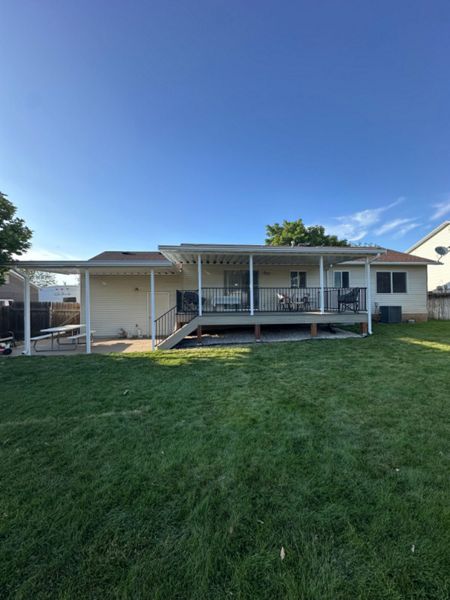 Built for comfort and style — Honey Grove Trex® decking, Trex Enhance® Steel railing, beautiful custom awnings, and solid PierTech footings make this deck a true standout.