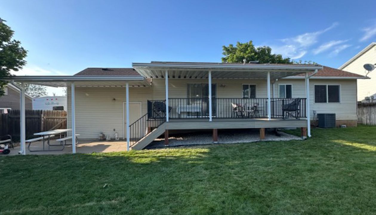 Built for comfort and style — Honey Grove Trex® decking, Trex Enhance® Steel railing, beautiful custom awnings, and solid PierTech footings make this deck a true standout.