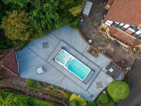 Trex Enhance Naturals Foggy Wharf with Trex Transcend Tropicals Island Mist, Kent. Our brief was to create a large deck to surround the swim spa with access panels for spa maintenance.