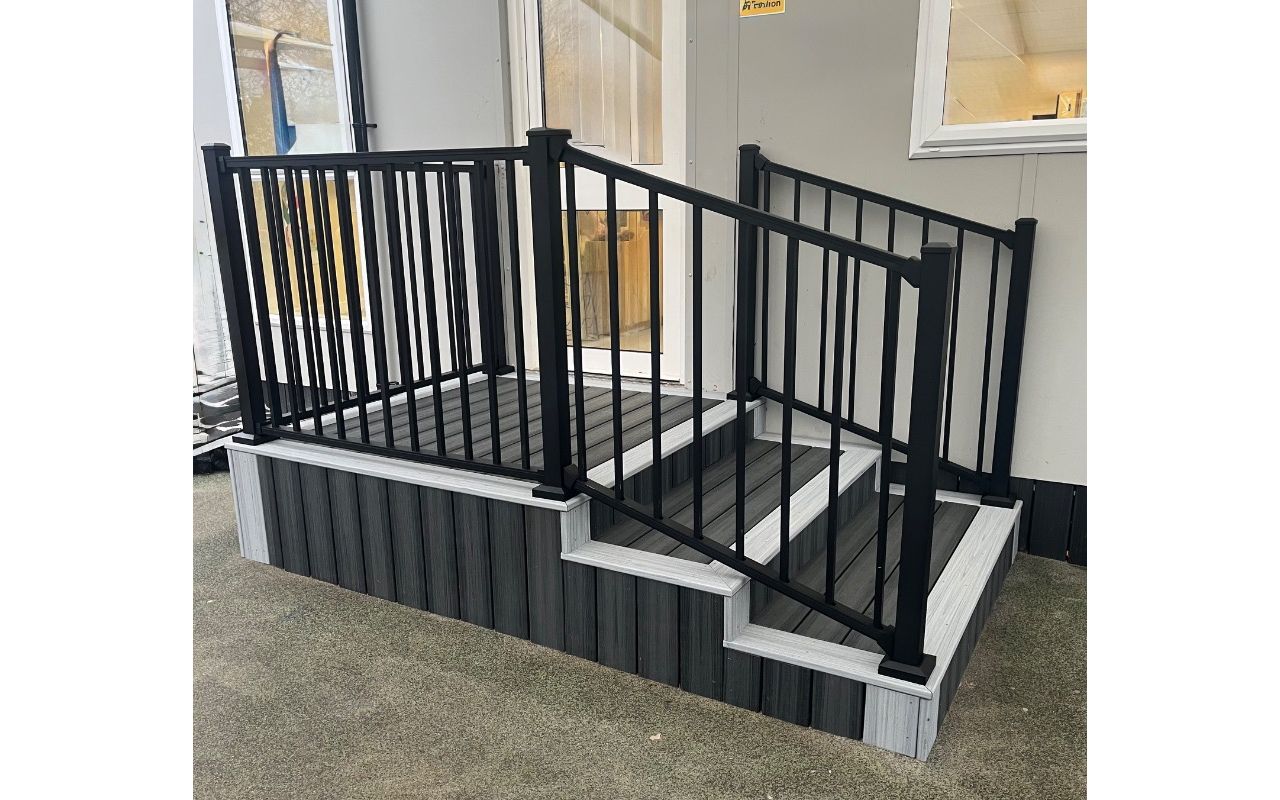 Trex Enhance Calm Water steps with Enhance Foggy Wharf border and Trex Signature Black railings