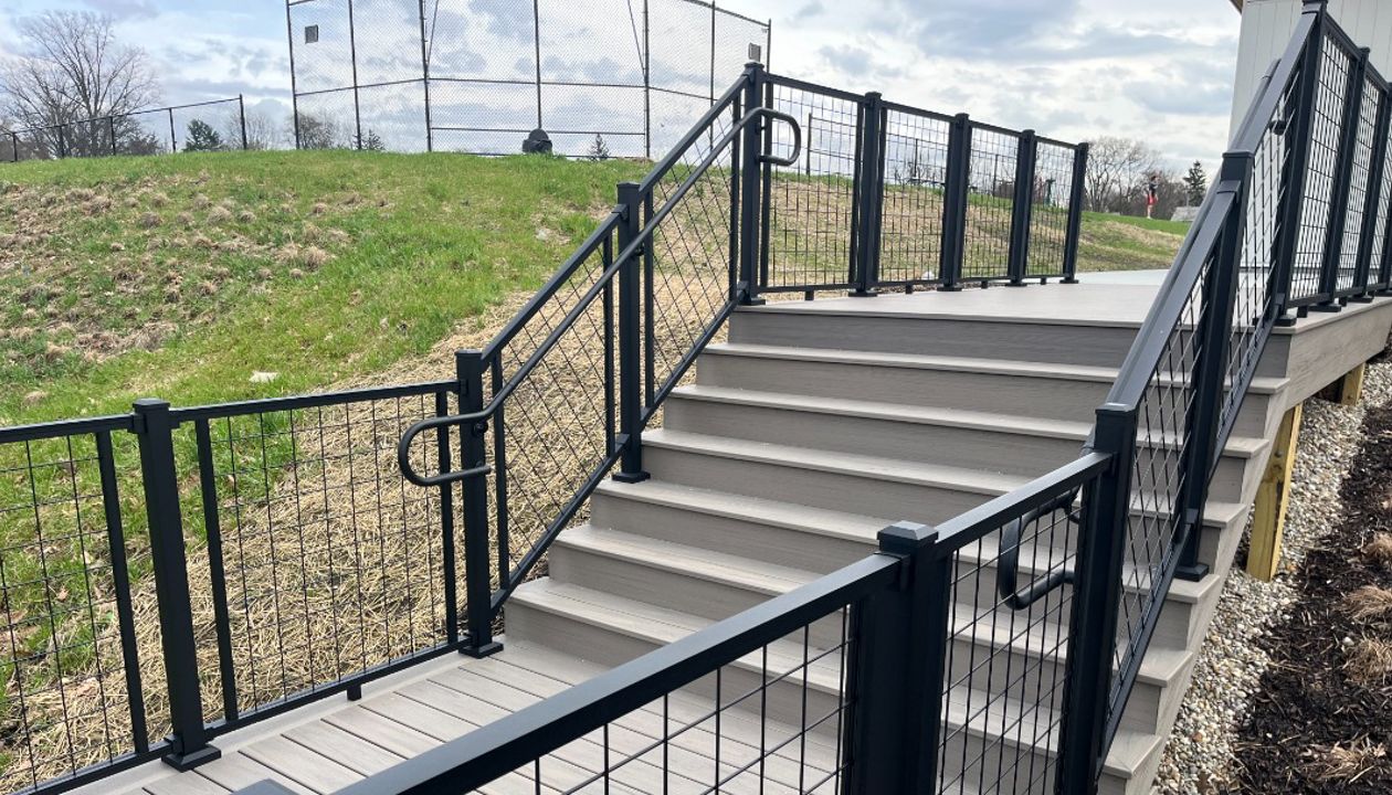 Trex Transcend Lineage Biscayne w/ Trex Signature Mesh railing in black.