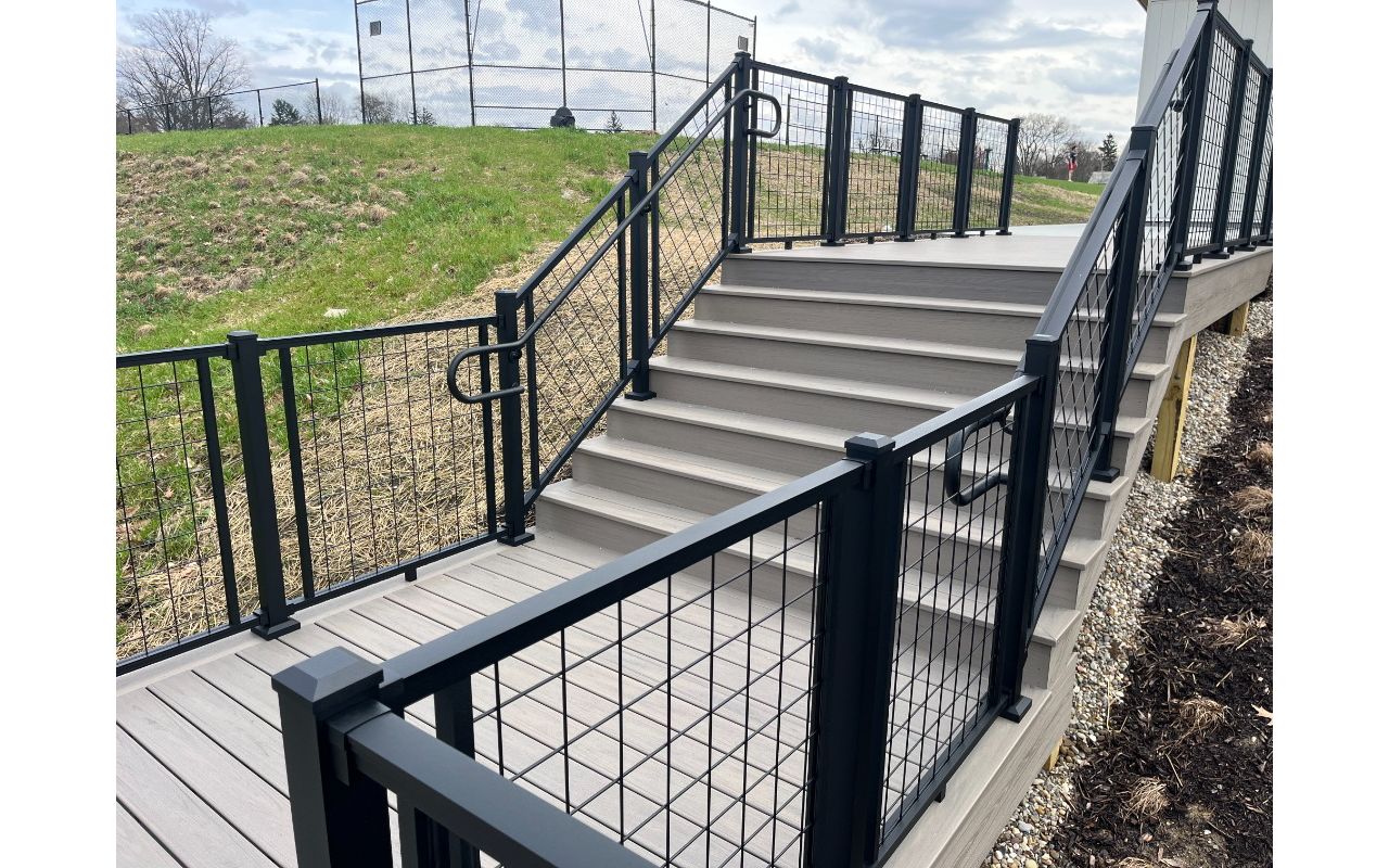 Trex Transcend Lineage Biscayne w/ Trex Signature Mesh railing in black.
