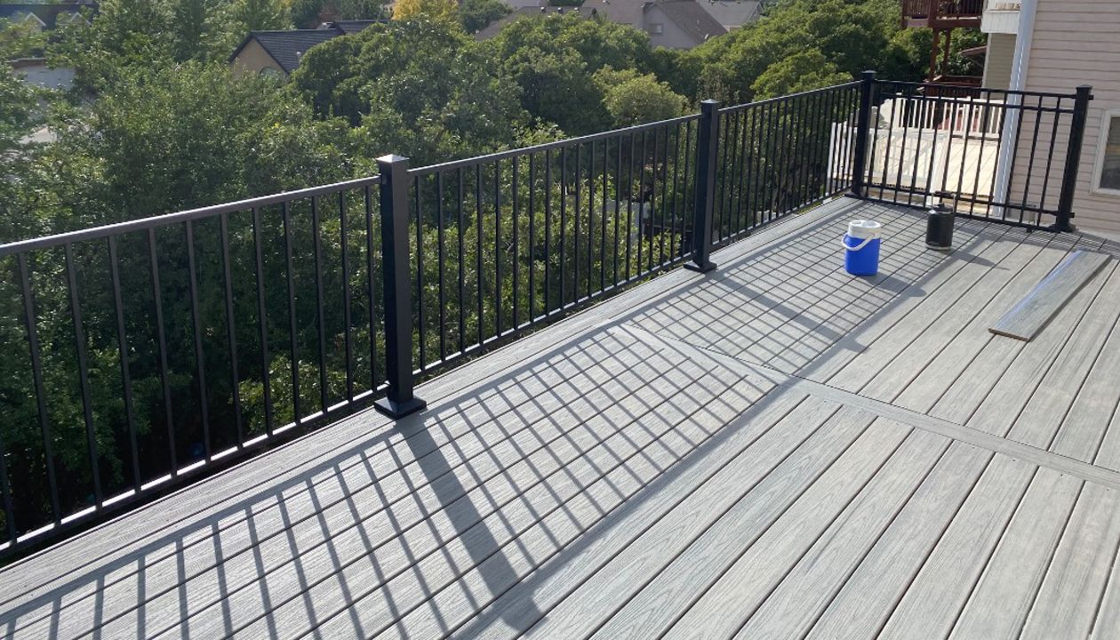 The perfect spot to soak in the view — this Trex® Pebble Grey second-story deck with Trex® Aluminum Railing blends strength, style, and mountain air.