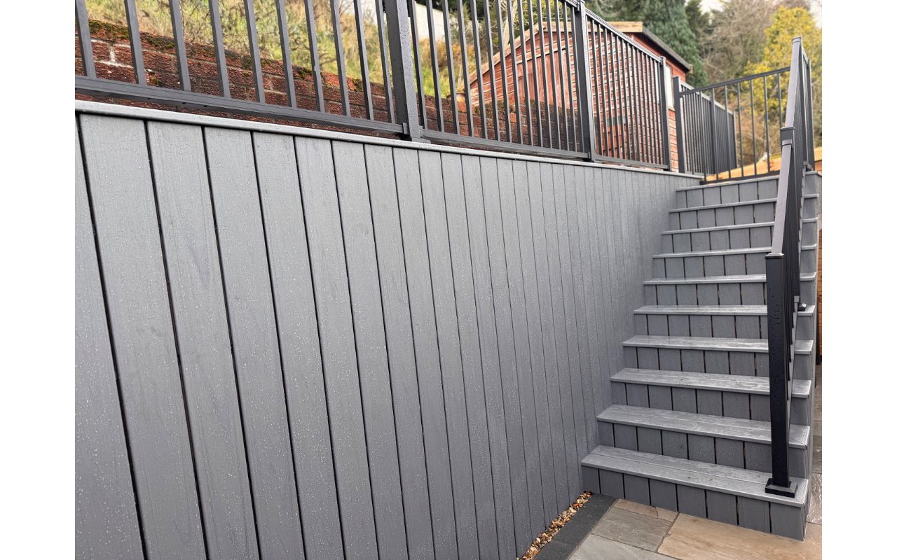 Trex transcend island mist lineage, stair case with raised decking wall way. Installed in Norwich, Norfolk