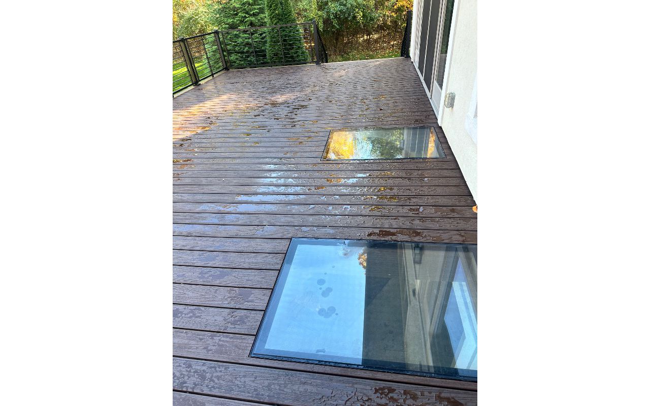 Trex Transcend Decking with Signature Rod Railing and SkyFloor lites.