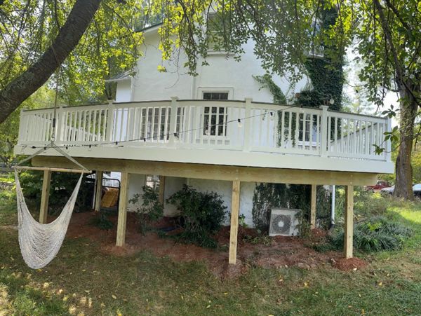 Transcend classic white railing. Post-to-post cocktail railing installation.