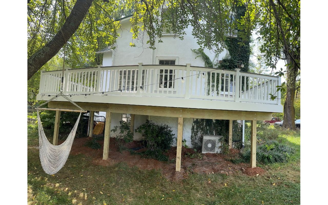Transcend classic white railing. Post-to-post cocktail railing installation.