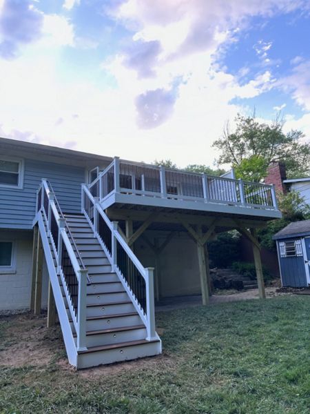 TREX Transcend classic white railing. TREX Enhance Beach Dune decking and step treads