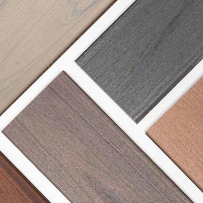 A collection of rectangular wood laminate samples is arranged in a geometric pattern. The samples display a variety of neutral shades, including grey, beige, brown, and taupe. The image highlights the texture and grain of each laminate, making it suitable for interior design or flooring inspiration. No visible text or numbers are present.