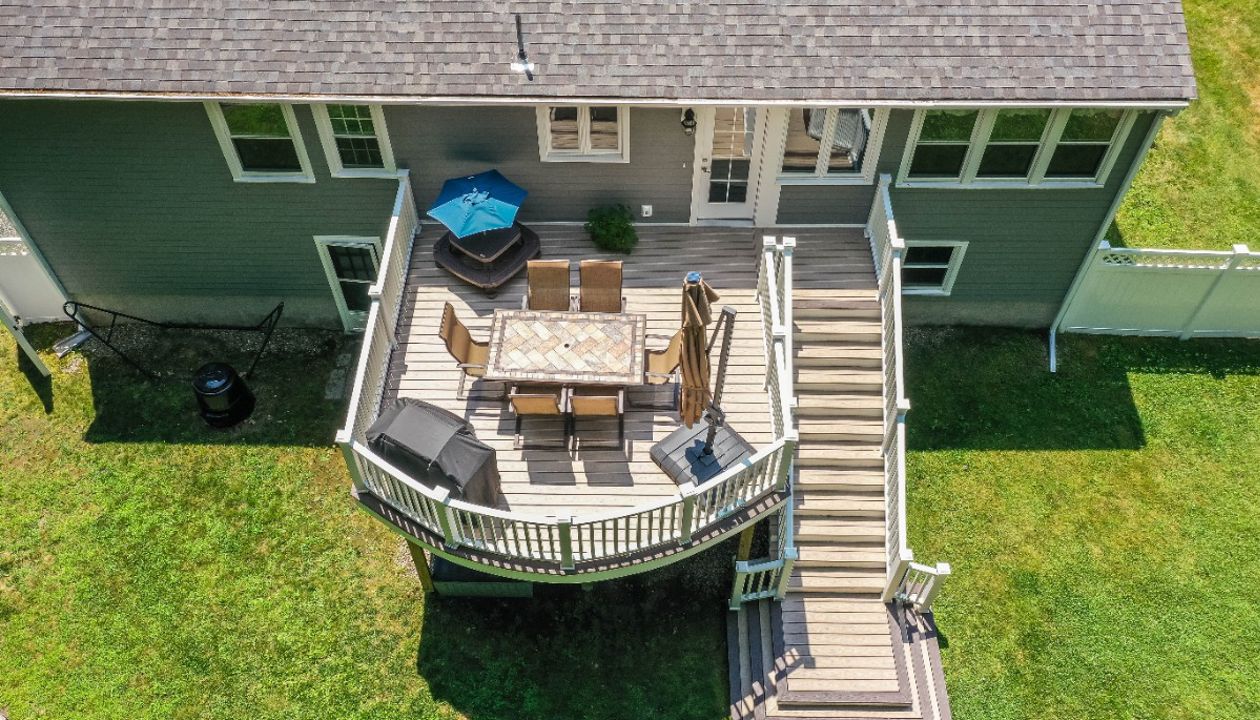 Professional Building Services Andover, MA Curved Decking & Cascading Staircase in Trex Transcend Spiced Rum