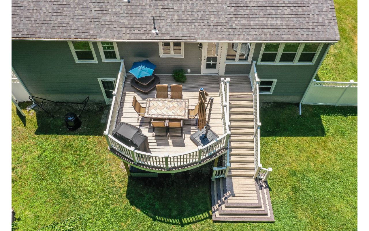 Professional Building Services Andover, MA Curved Decking & Cascading Staircase in Trex Transcend Spiced Rum