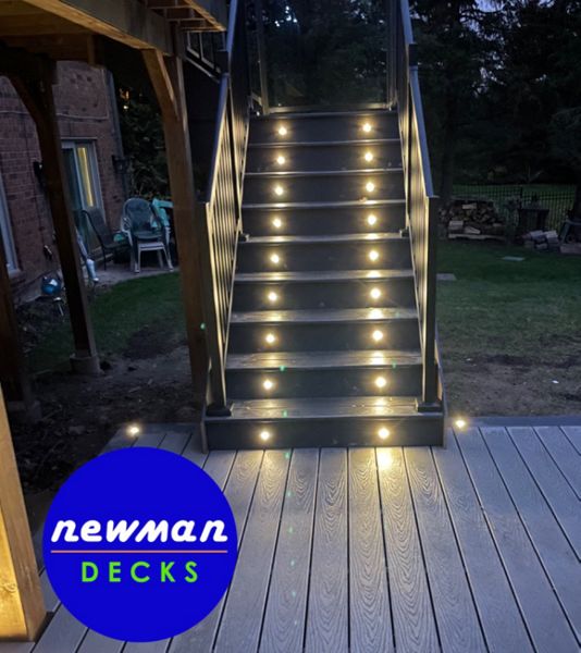 Newman Decks Trex composite stairs with aluminum picket railings and LED lighting