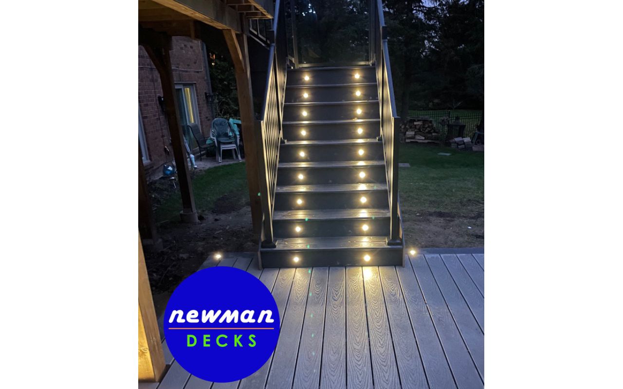 Newman Decks Trex composite stairs with aluminum picket railings and LED lighting