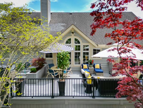 February 2024 Trex Deck and Privacy Wall Project in Loveland Ohio. The decking and skirting is the Lineage series in color Rainier.  The railing is Trex Signature in Black