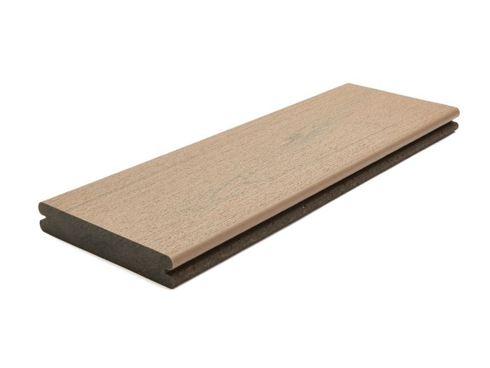 A single composite decking board is shown against a white background. The board features a light brown wood grain finish on the top surface and a darker core, highlighting its layered construction. The clean, isolated presentation emphasizes the material and texture, suitable for outdoor decking projects. No visible text or numbers are present on the board.