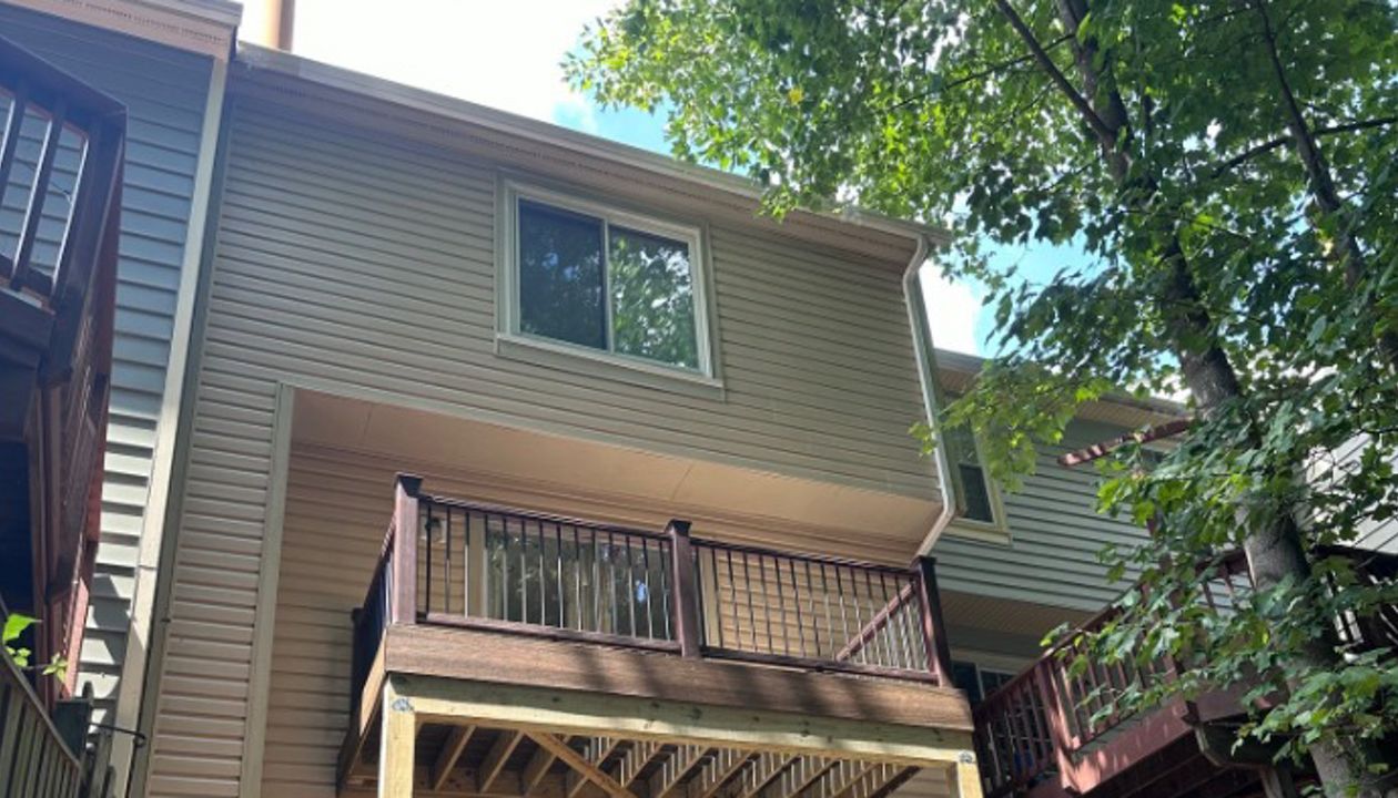 Transcend Vintage Lantern railing. Black round aluminum balusters. TREX Enhance Toasted Sand decking, fascia and step risers