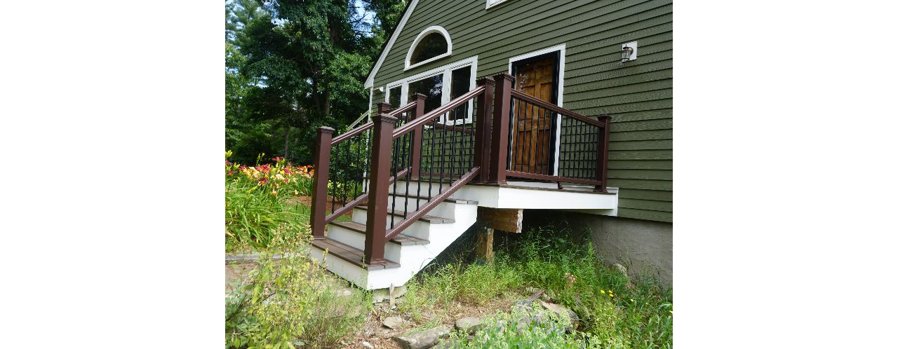 Londonderry, NH Professional Building Services Small Platform in Transcend Spiced Rum with Transcend Vintage Lantern Railing and Black Round Metal Balusters