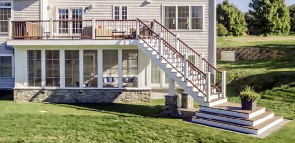Westford, MA Professional Building Services Design-Build with 4 Season Room, Steel Framing, Cascading Staircase in Transcend Spiced Rum & Vintage Lantern Railing, White Posts, and Black Round Metal Balusters
