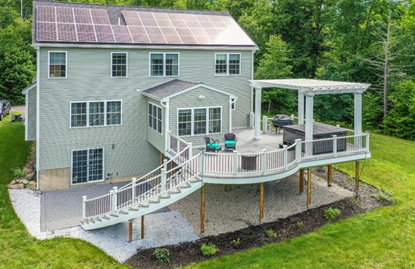Hopkinton, NH Professional Building Services Mega Curved Deck & Curved Staircase with Steel Framing, Trex Pergola, and Jacuzzi Support