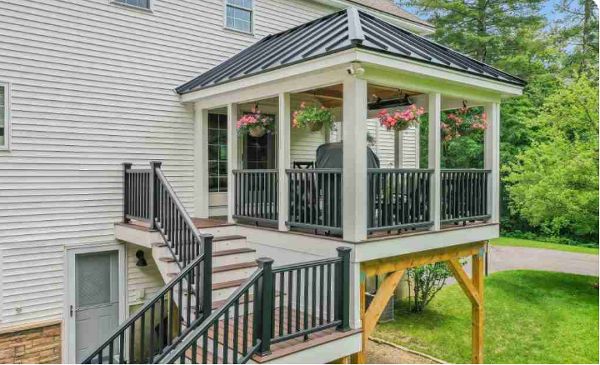 Salem, NH Professional Building Services Covered Porch in Transcend Spiced Rum Decking with Transcend Black Square Railing