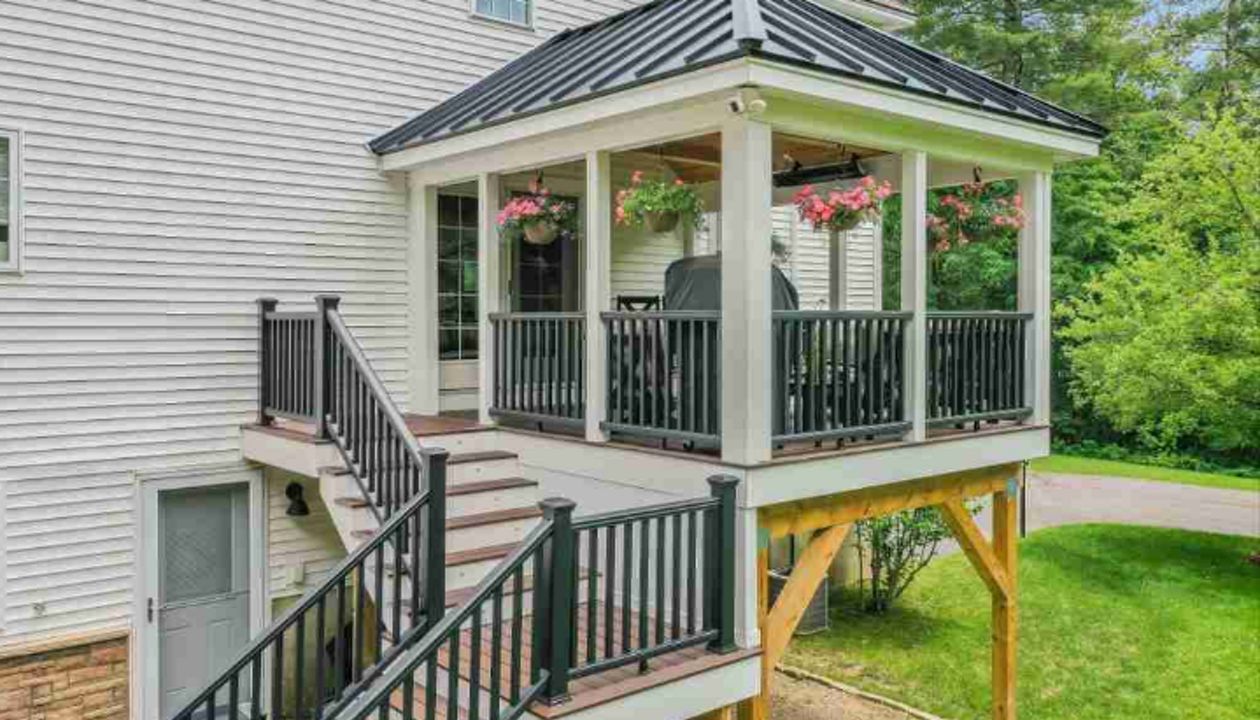 Salem, NH Professional Building Services Covered Porch in Transcend Spiced Rum Decking with Transcend Black Square Railing
