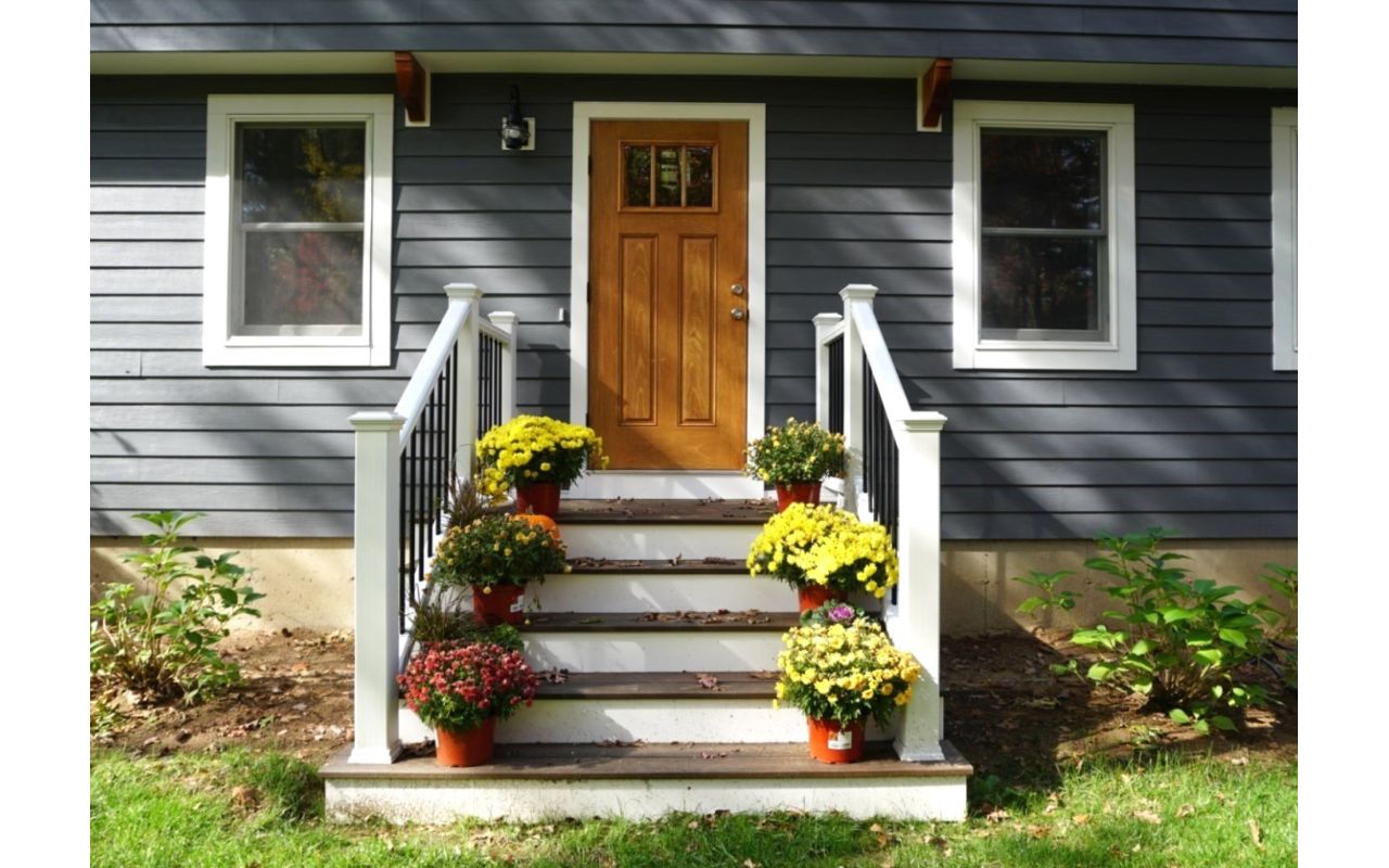 Lee, NH Professional Building Services  Entry Deck in Transcend Spiced Rum with Transcend White Railing & Black Round Metal Balusters