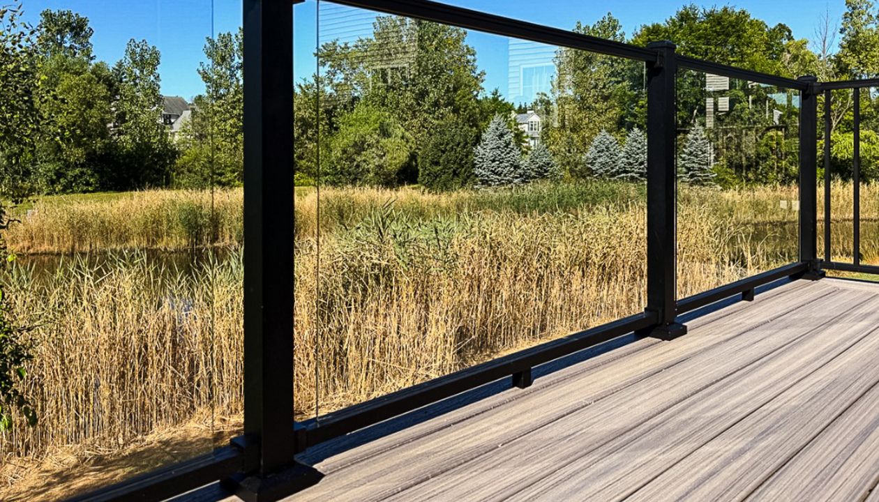 Trex Signature with Glass Railing & Enhance Naturals Rocky Harbor Decking