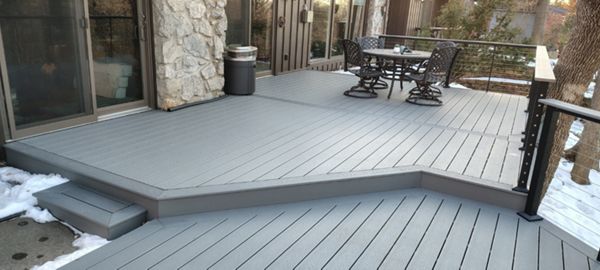 Trex Select Pebble Grey decking installation with black powder coated cable railing.