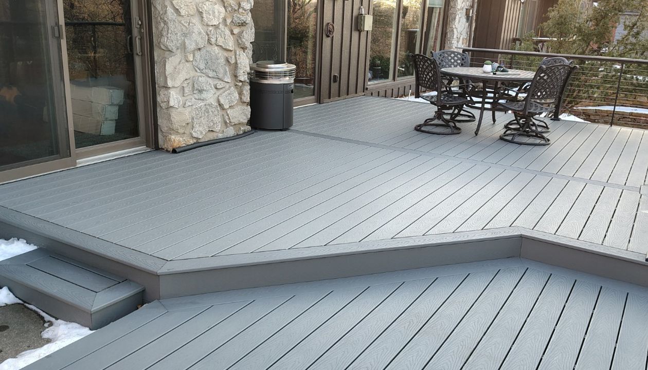 Trex Select Pebble Grey decking installation with black powder coated cable railing.