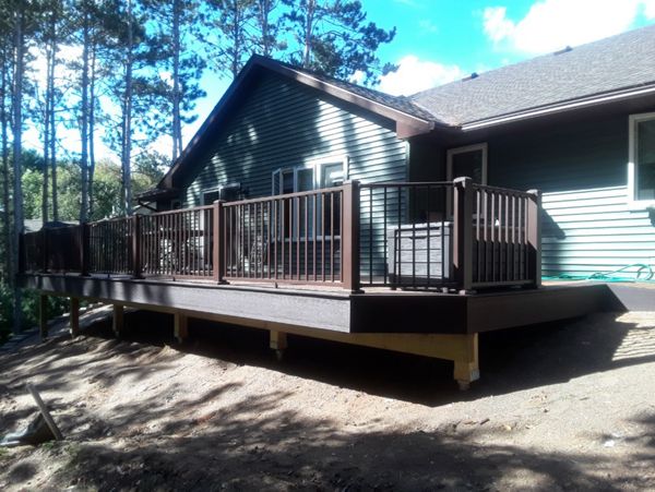 Low-maintenance composite Trex Select decking and Bronze Alum Railing