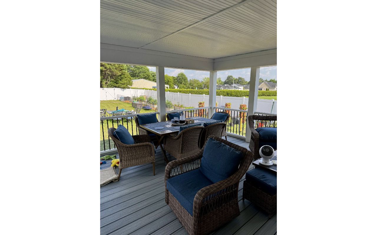 Trex Foggy Wharf composite deck installation with white railing and black spindles by local Lillington, NC contractor.