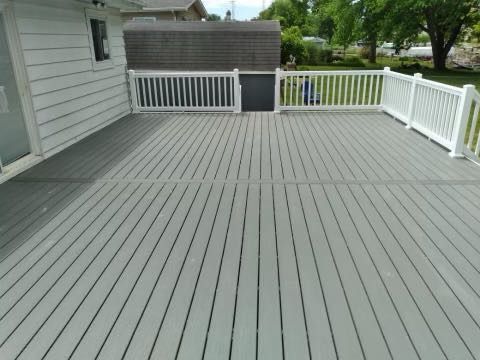 Clam Shell Decking with white railing.