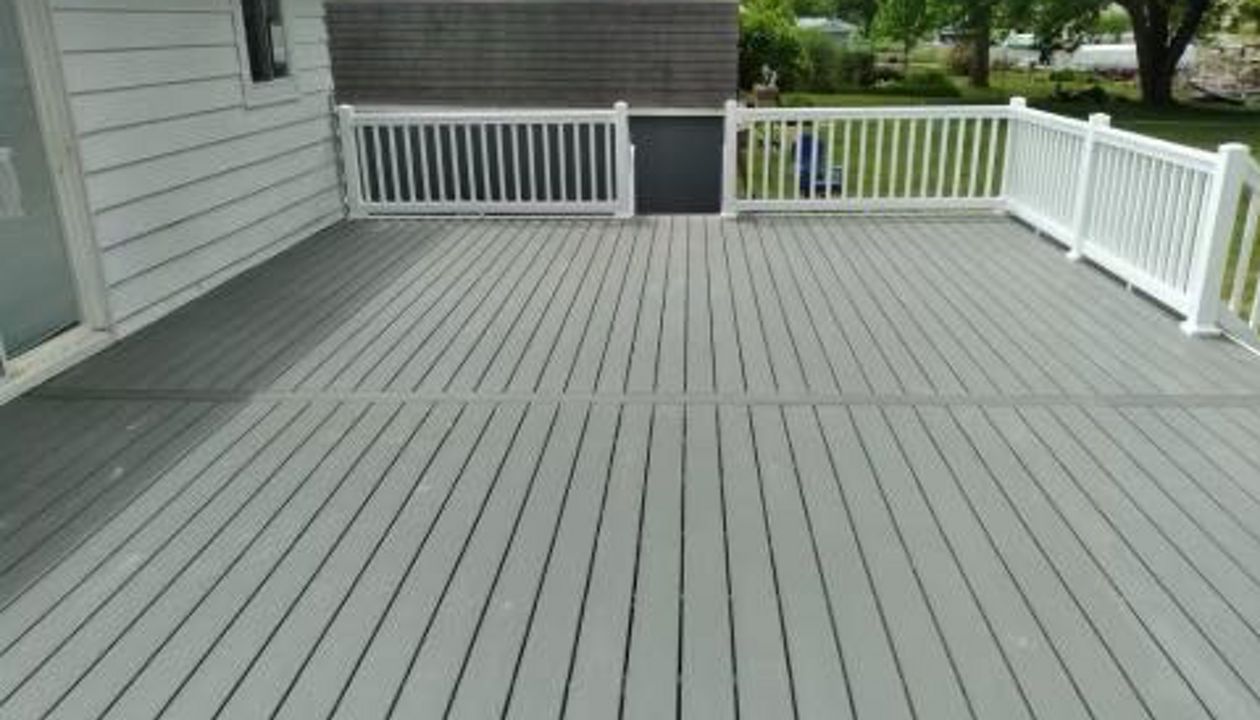 Clam Shell Decking with white railing.