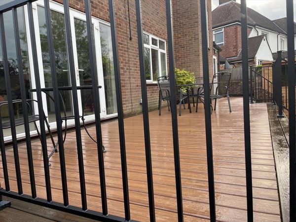 Karl Harrison designs decking terrace with steps in Pinner. Trex Transcend Spiced Rum with Tiki Torch colours