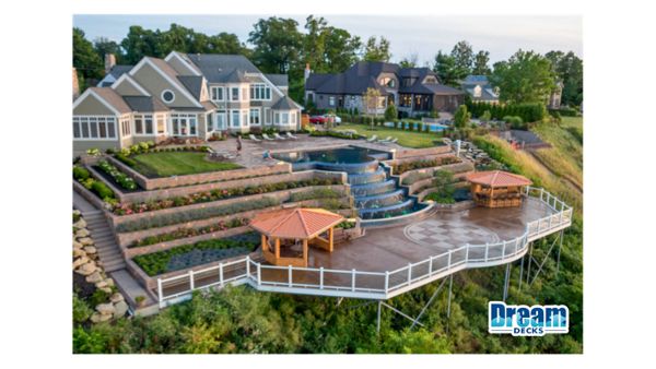 This isn’t a backyard. It’s a destination.  Multi-level outdoor living built into the landscape, featuring expansive decking, custom structures, and a statement waterfall that ties the entire space together.