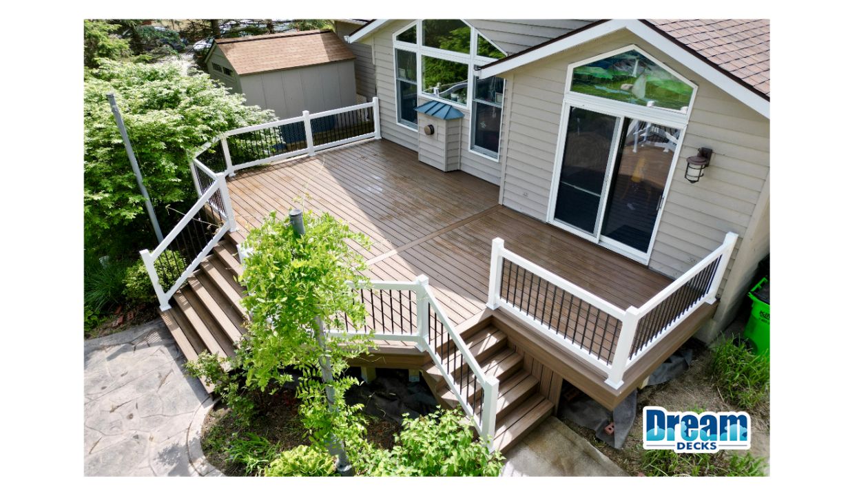 Simple done right.  Built with Trex Enhance Naturals in Toasted Sand, this deck brings a warm, natural tone that fits seamlessly with the home. Finished with clean white railing and black balusters for a sharp, modern contrast.
