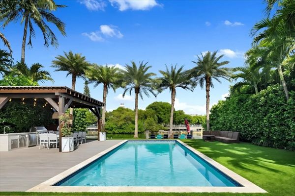 Poolside day view with Palm Trees: Modern Trex pool side deck in Miami Beach