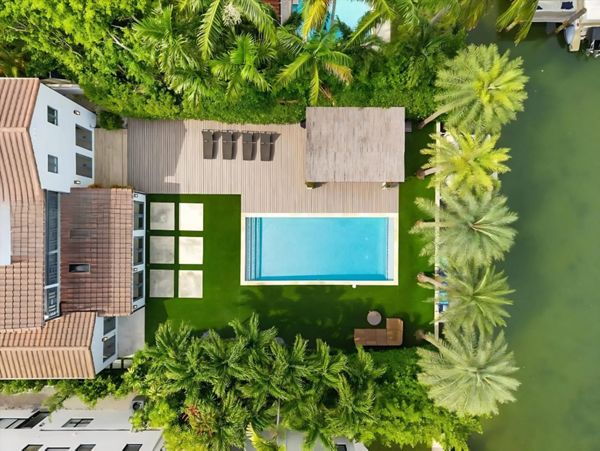Arial view of custom Trex deck, pool, and tropical landscape