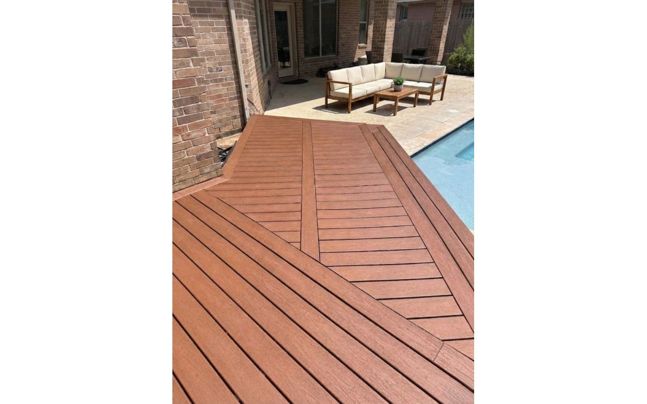 Custom diagonal composite deck design by the pool. Unique layout that enhances visual flow and creates a luxury outdoor experience.