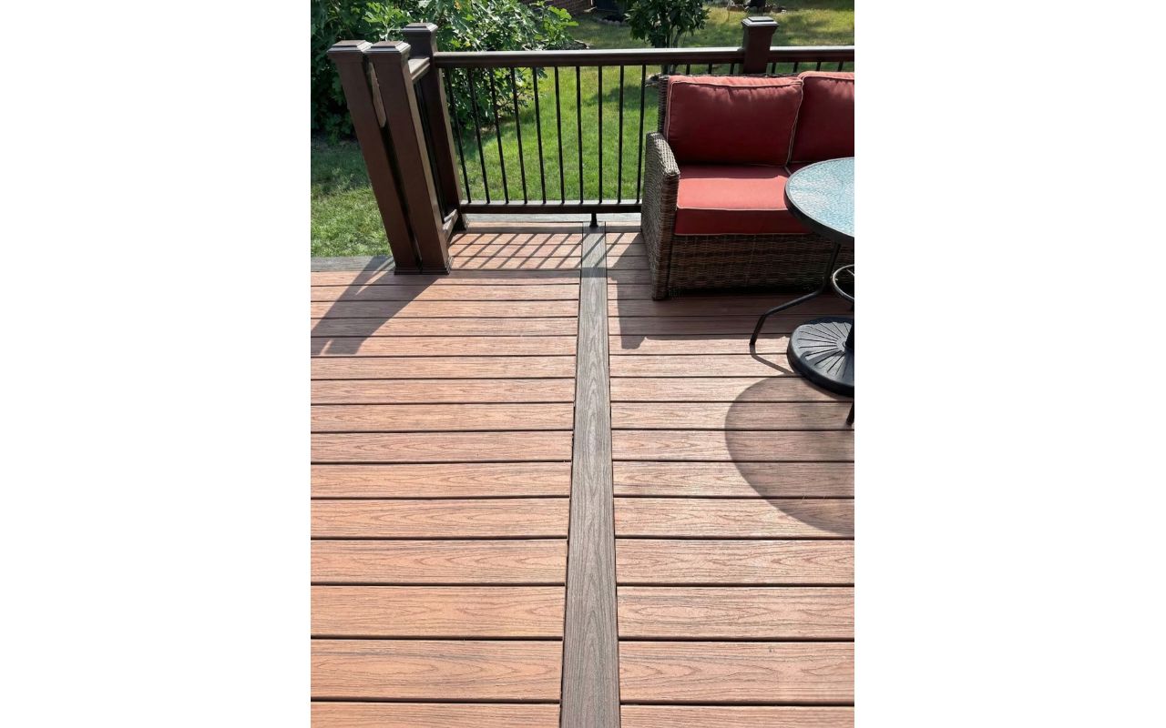 Custom Trex composite deck installation in Houston, TX with clean center inlay detail. Designed for durability, low maintenance, and a modern outdoor living experience. Built by Iconic Upscale.