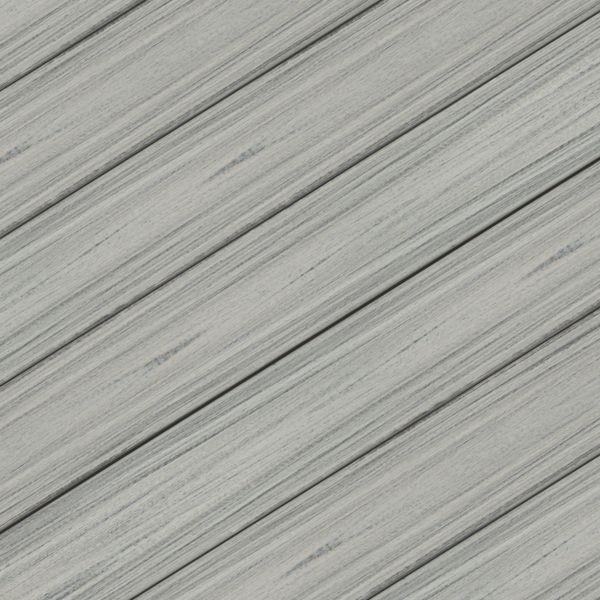 This image features a close-up view of weathered wooden planks arranged diagonally. The wood has a gray, distressed finish with visible grain and subtle streaks, creating a rustic and aged appearance. The overall palette is muted and neutral, emphasizing the natural texture and linear pattern. No text, numbers, or identifiable brands are visible in the image.
