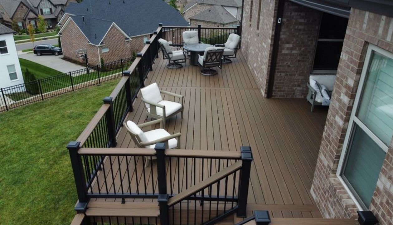 Enhanced Toasted Sand decking and Fascia with Charcoal Black Railing and Drink Rail